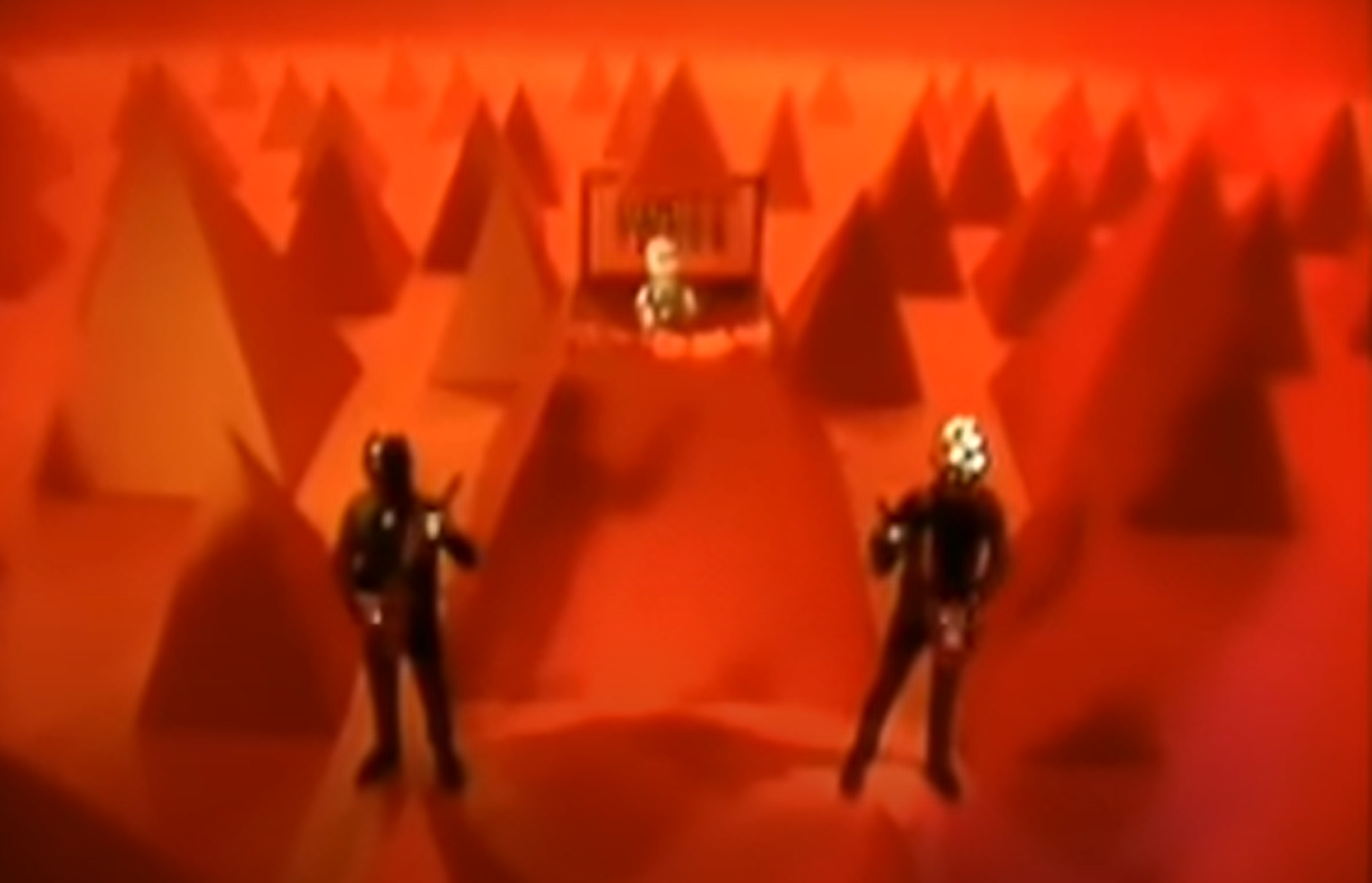 Screenshot of the music video for Technologic by Daft Punk. Note the triangles.