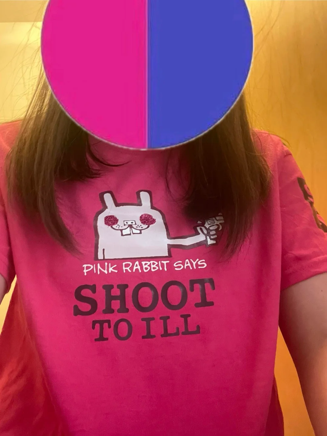 Image of me wearing the Pink Rabbit shirt. Shows off how you don't even notice that the design is too small.